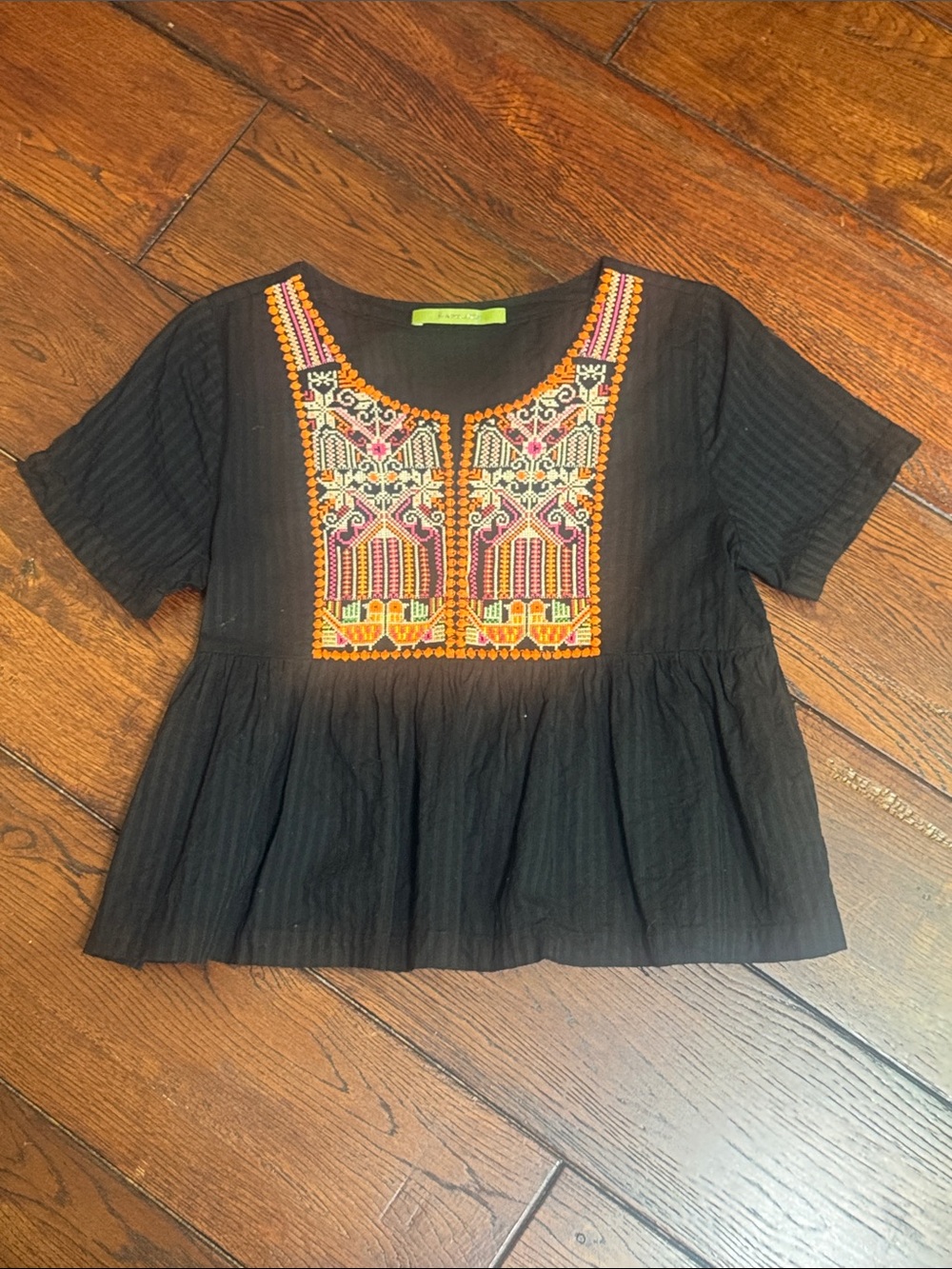 Rapsodia Black Embroidered Peplum Top with Multicolor Embroidered Chest Panel